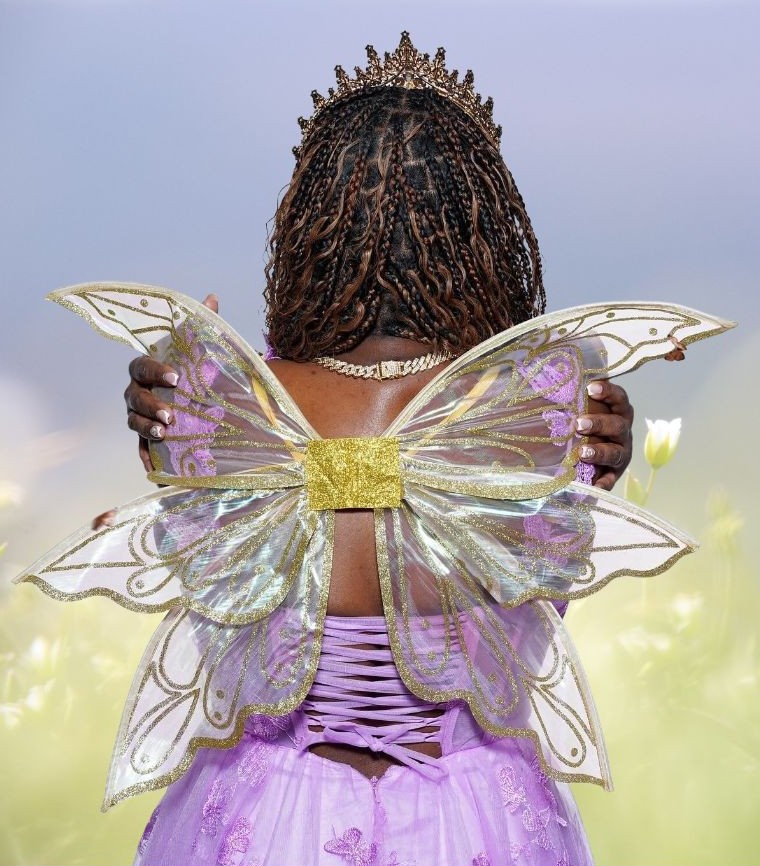 Neoorah Williams in butterfly wings and crown